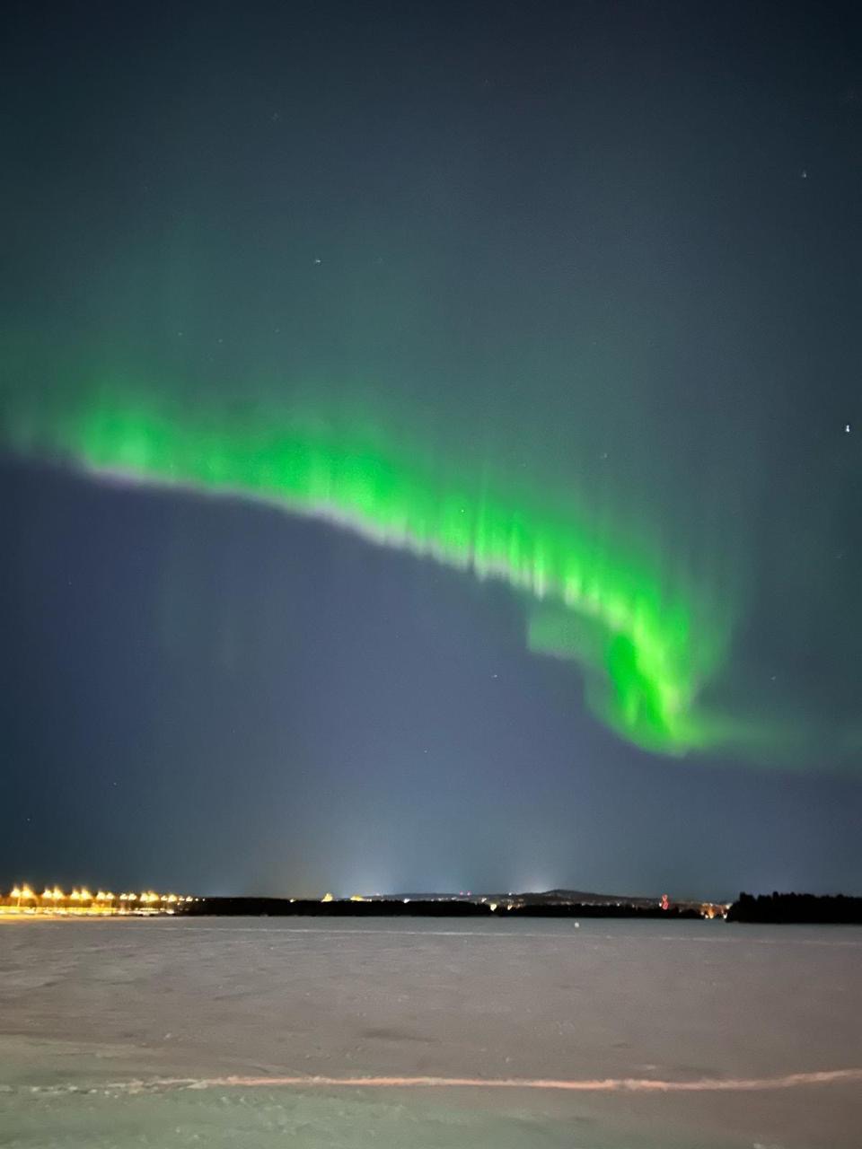 Aurora above a frozen lake